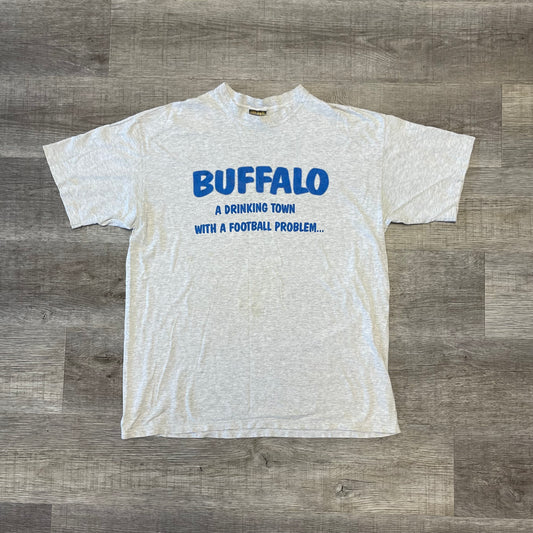 Vintage 1990s Buffalo a Drinking town with a football Problem Shirt Size XL